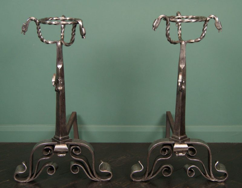A Pair of Large Ornate Polished Wrought Andirons