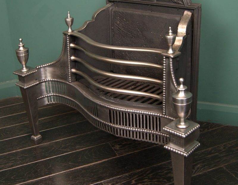 A Polished Steel Dog Grate by T Elsley