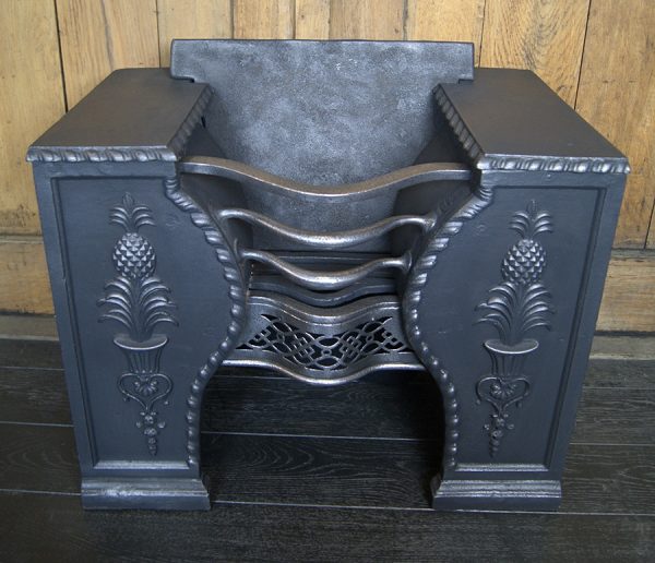 A Cast-Iron Hob Stove Grate with Pineapples