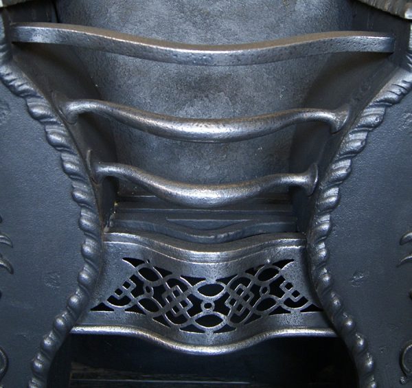 A Cast-Iron Hob Stove Grate with Pineapples