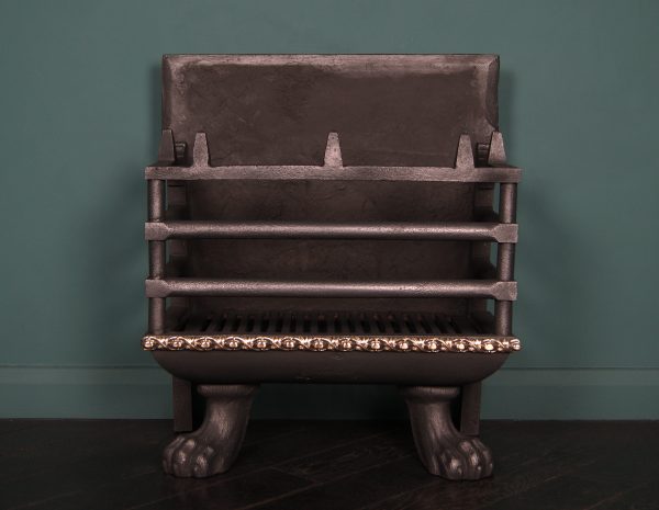 A Large Wrought and Cast-Iron fire basket in the Regency manner