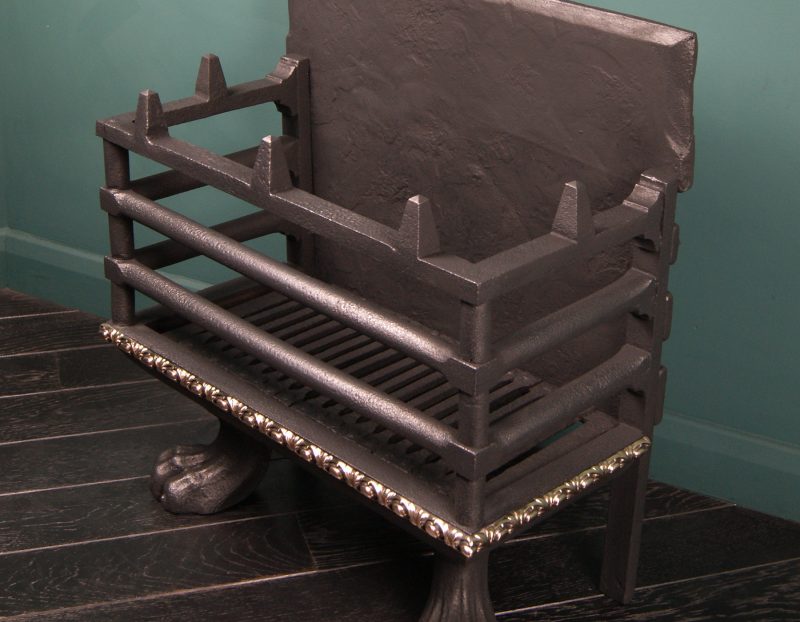 A Large Wrought and Cast-Iron fire basket in the Regency manner