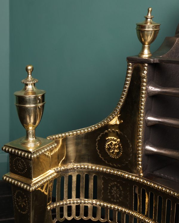 A 19th Century English Brass Decorative Dog Grate