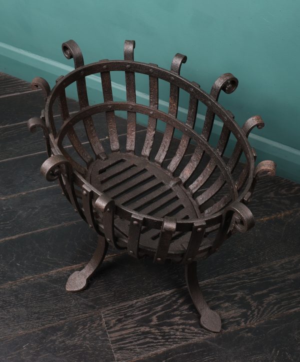An Oval Wrought Fire Basket