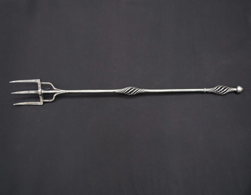 A Large Arts & Crafts Wrought-Iron Fireplace Log Fork
