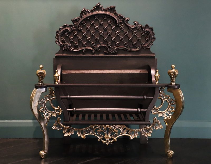 A Rococo Iron & Brass Fireplace Fire Basket in the Chippendale Manner