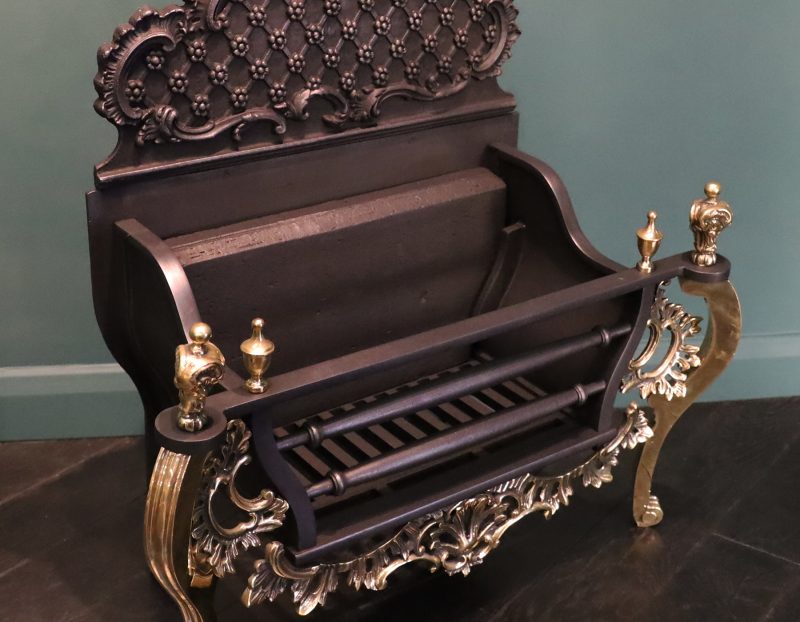 A Rococo Iron & Brass Fireplace Fire Basket in the Chippendale Manner