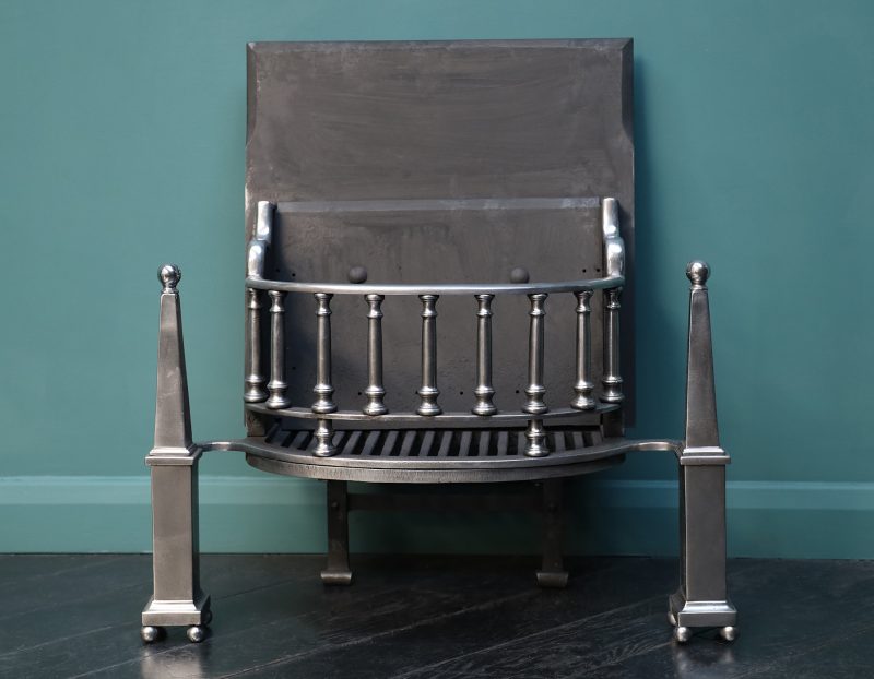 A Polished Steel Fire Grate with Pinnacle Finials