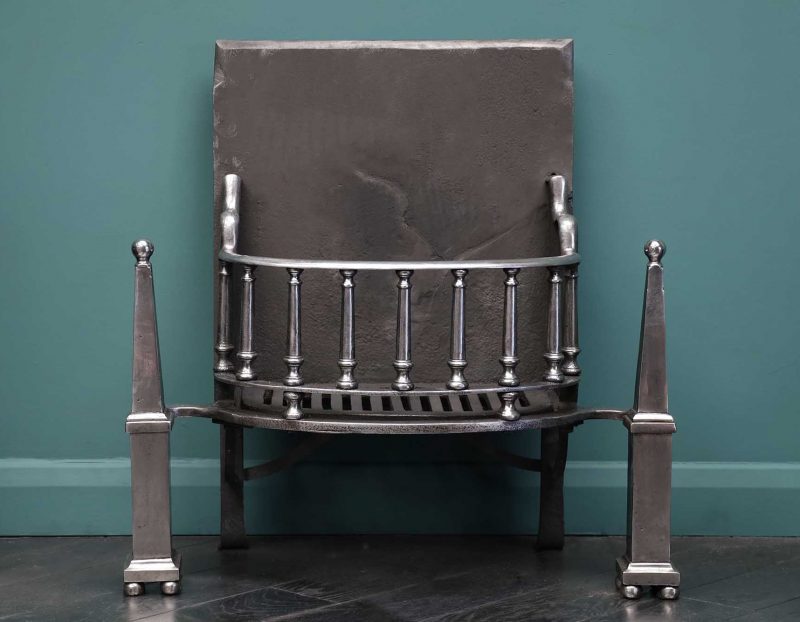 A Polished Steel Fire Grate with Pinnacle Finials