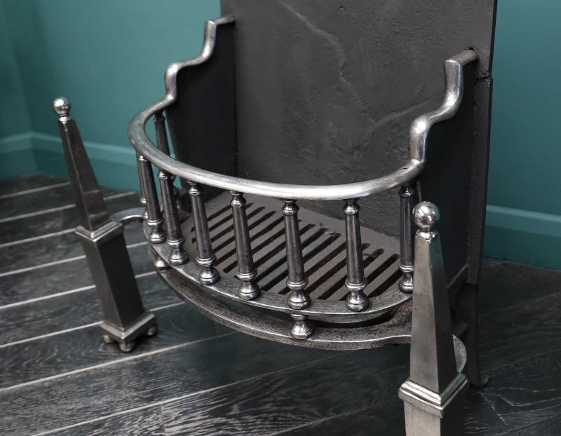A Polished Steel Fire Grate with Pinnacle Finials