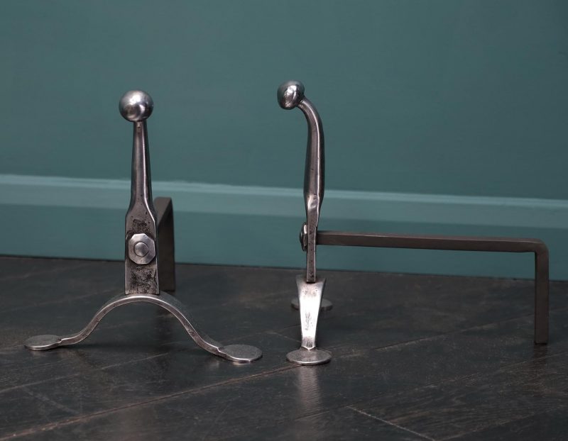 A Pair of  Mid-19th Century Polished Wrought Fire Dogs