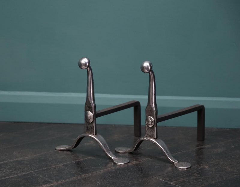 A Pair of  Mid-19th Century Polished Wrought Fire Dogs