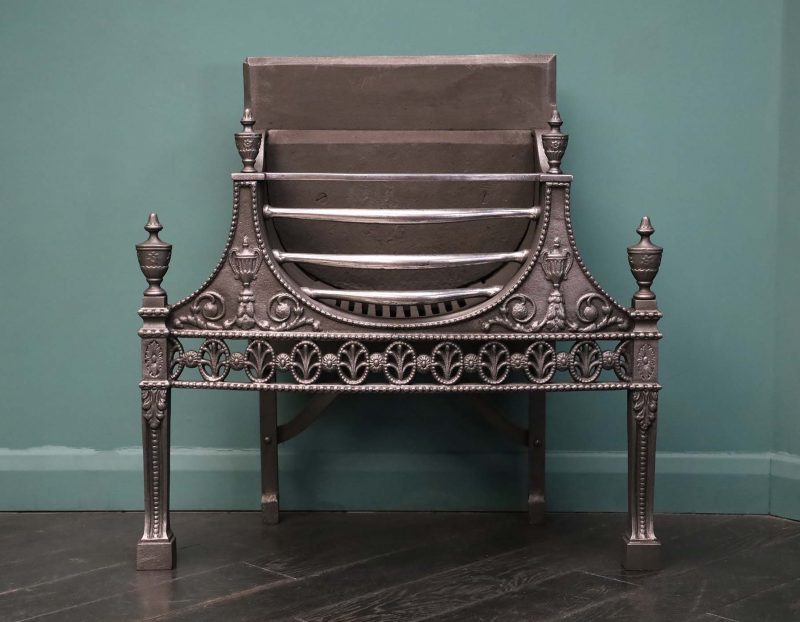 An Elegant 19th Century Wrought & Cast Fire Grate in the Neo-Classical Manner