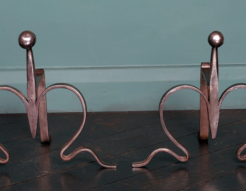 A Pair of Wrought Arts & Crafts Fire Tool Rests with ball finial